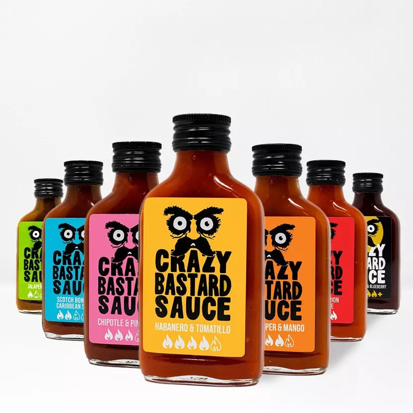 „Crazy Bastard“ aštrių padažų rinkinys, 7 vnt. – nuo švelnaus iki labai aštraus, 100 ml x 7 – šoninis vaizdas | Beata Nicholson